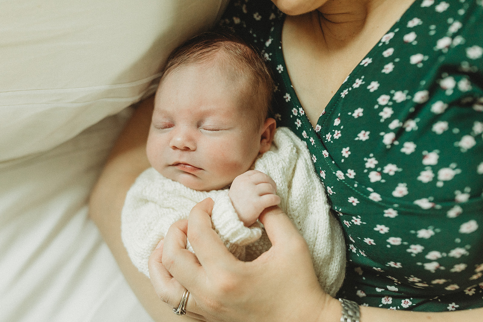 mom and newborn baby at in-home newborn photo session