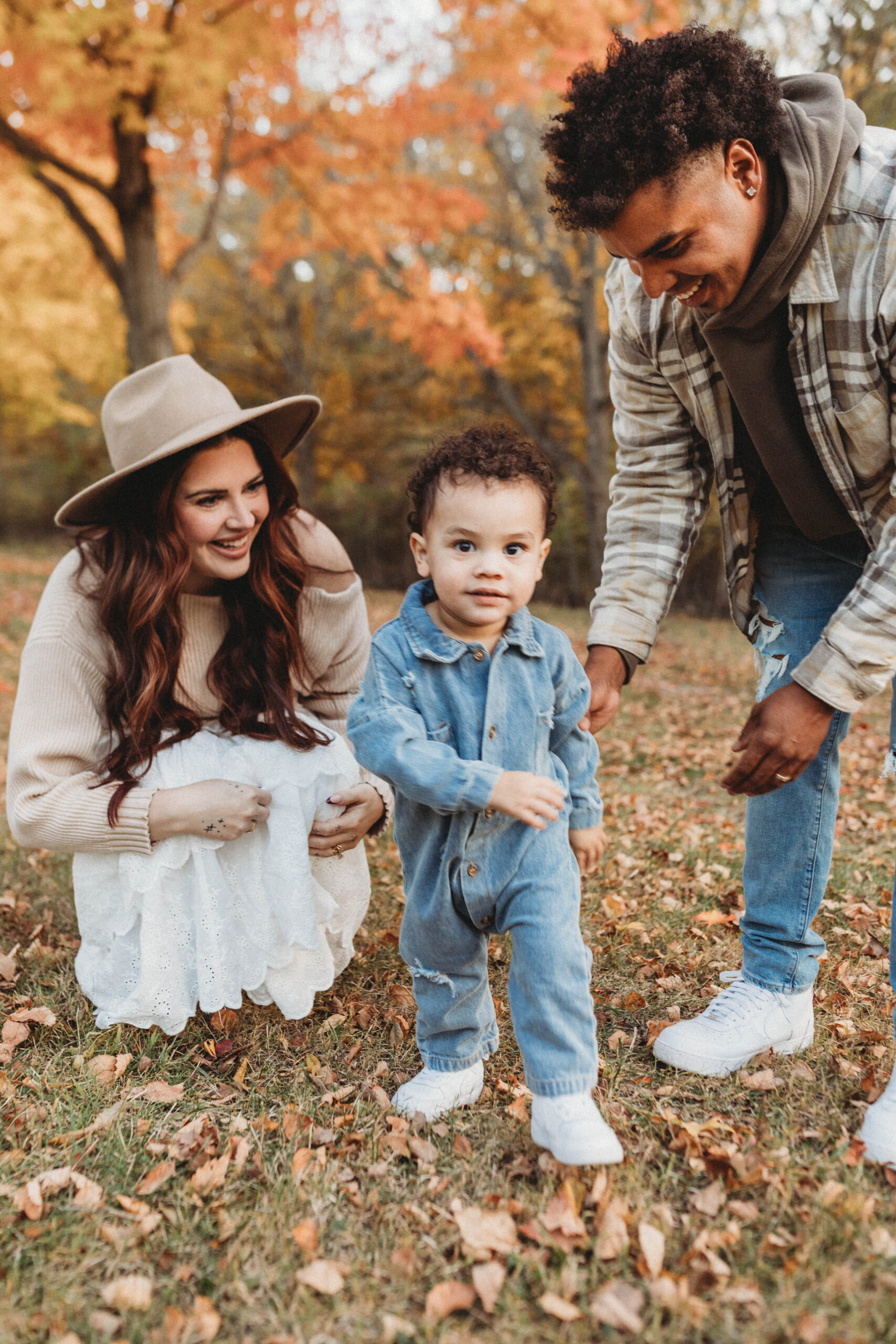 family in fall outfits at Hickory Hill Park in Iowa City