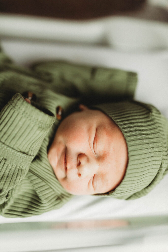 hospital photo of newborn baby in bassinet