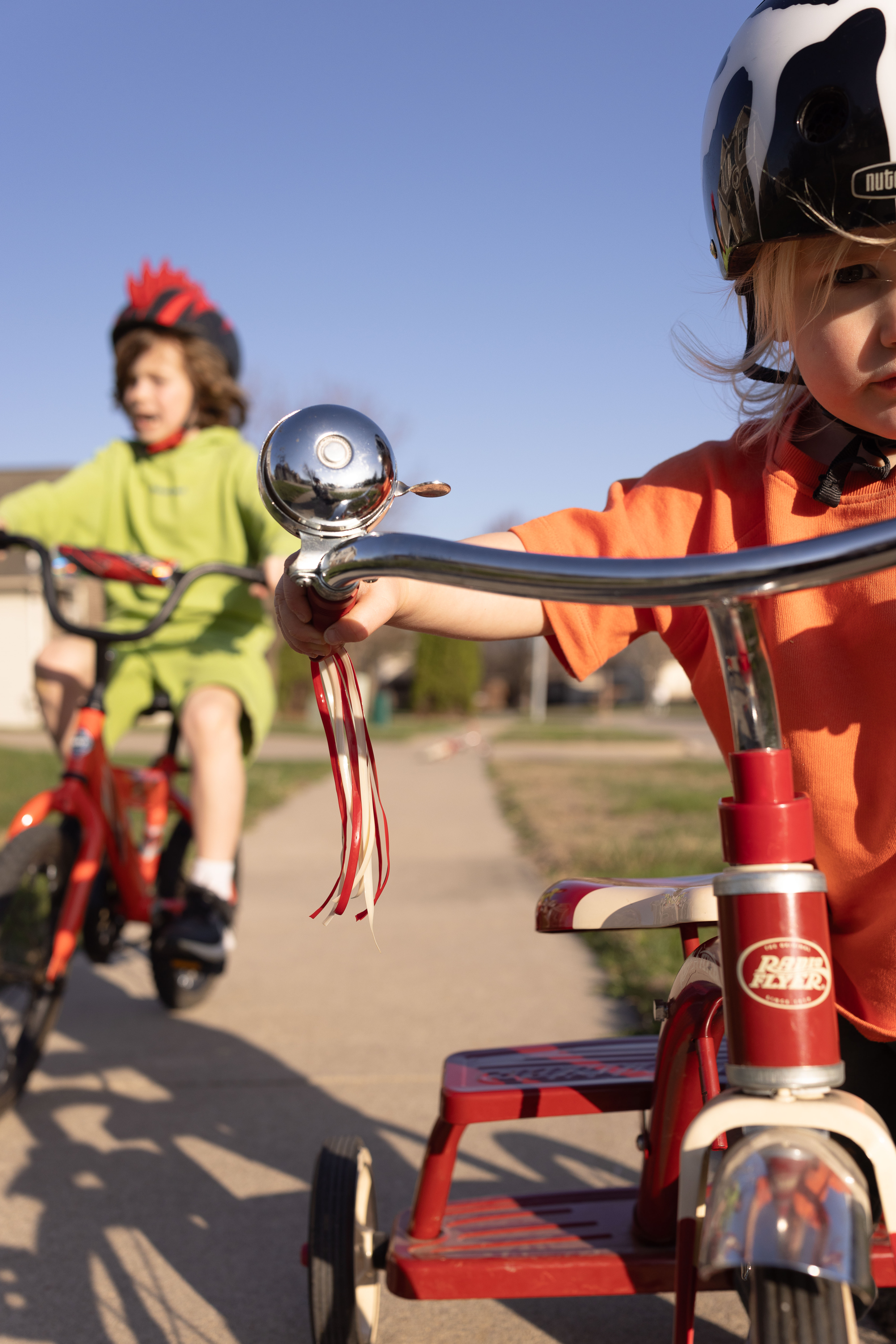 kids having fun on bikes in driveway in Iowa City
