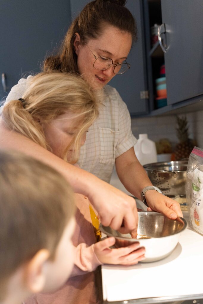 family baking together during a iowa family video session