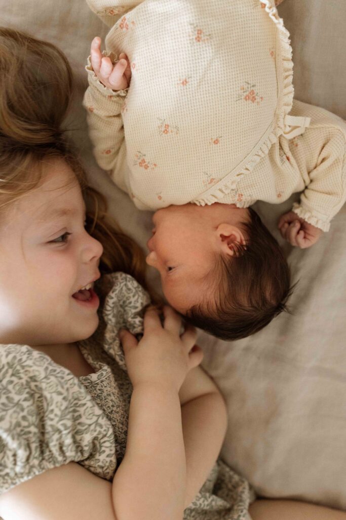 newborn baby with sibling 