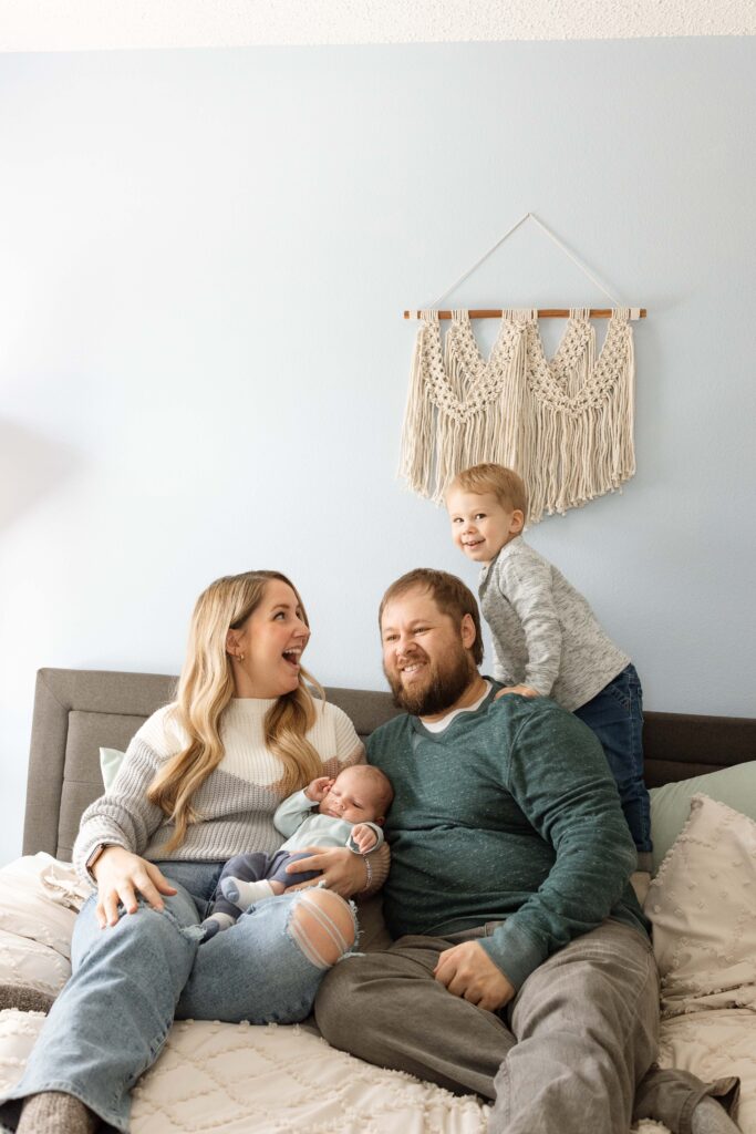 family at home with newborn baby
